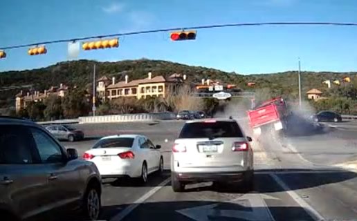 Dump truck creating a traffic hazard at intersection of Hill Country roads similar to State Highway 46, FM 3009, and FM 1863