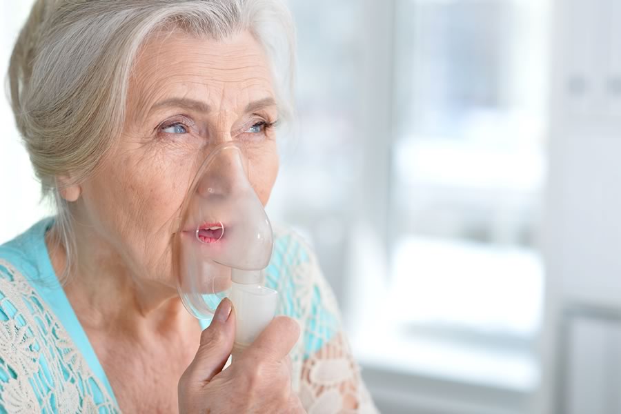 Elderly woman struggling to breathe, lung disease