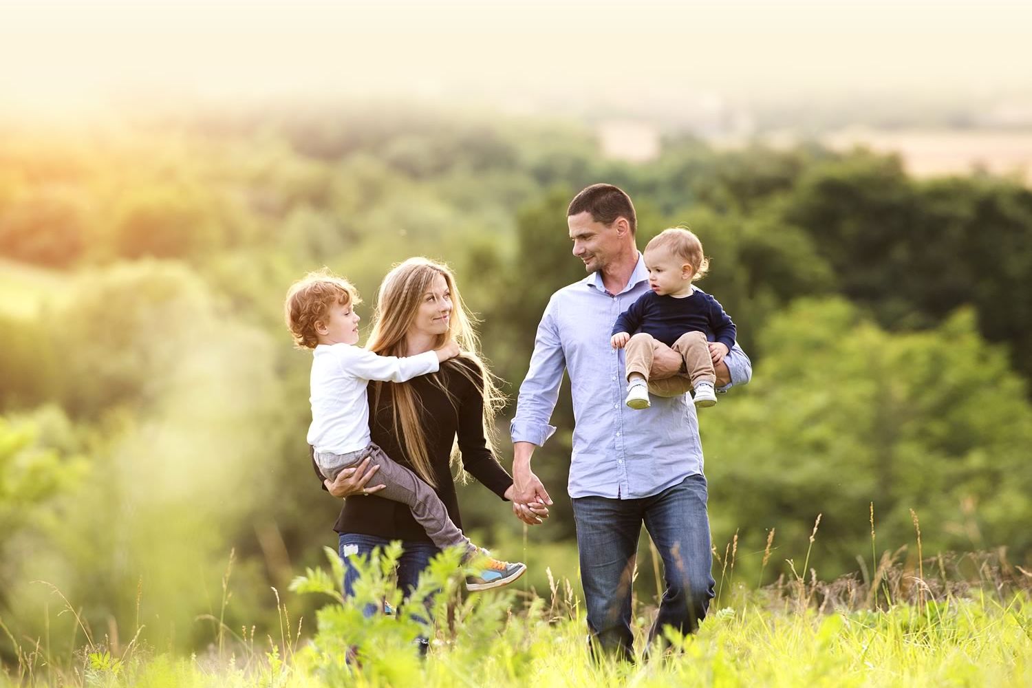 Family walking outdoors, enjoying nature in Hill Country