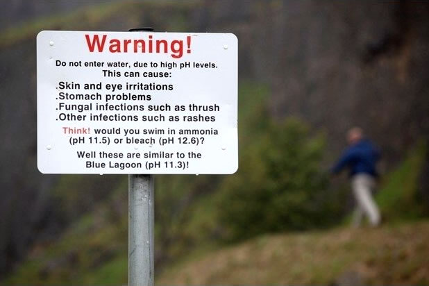 Warning sign posted near former rock quarry