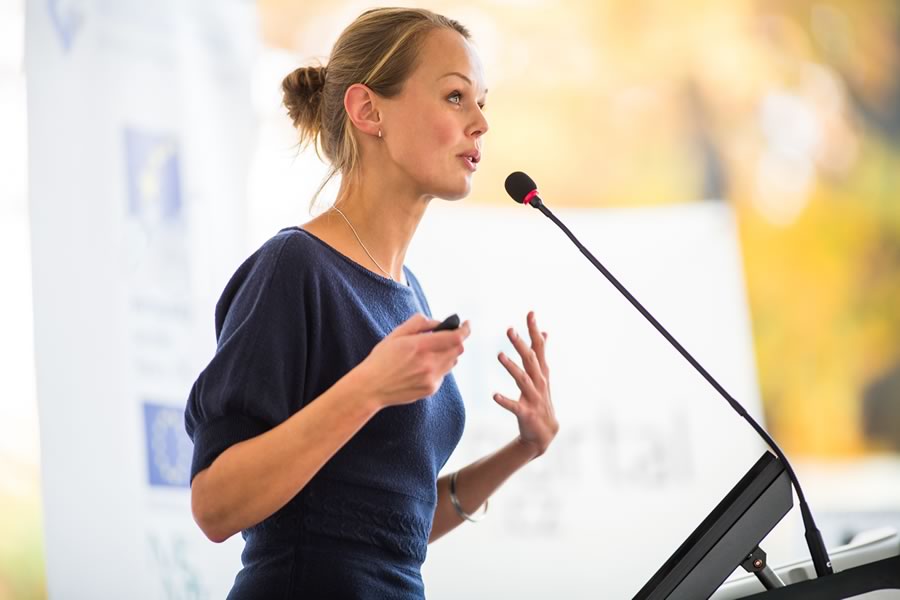 Woman speaking at public meeting