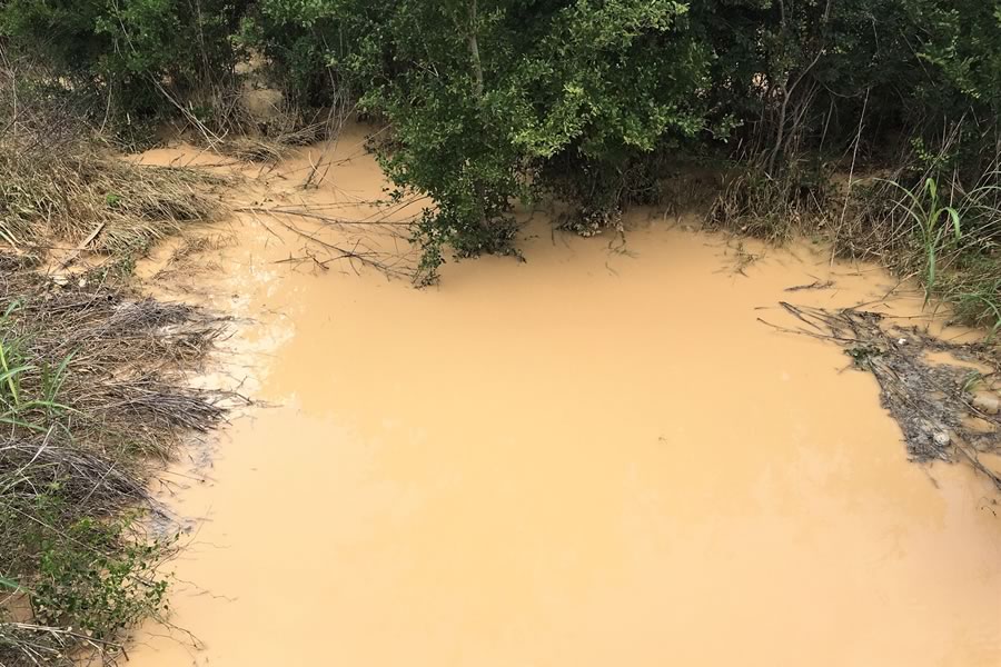 Liquid from Apparent Breach in Tailing Pond Dam from Anderson Columbia Quarry in Edwards Aquifer Recharge Zone, Comal County, Texas