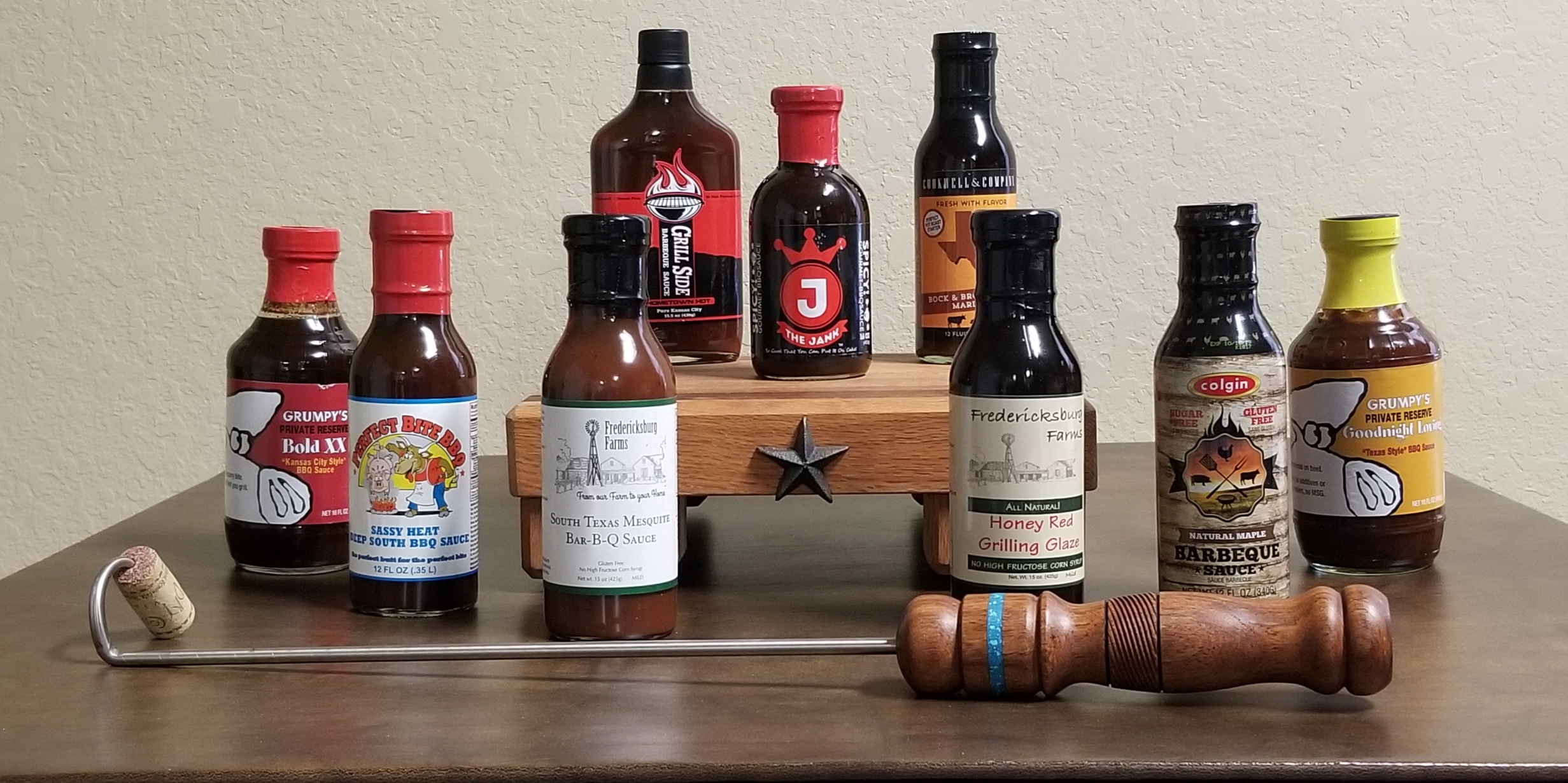 Online Secret Bid Auction Item: Homestyle Bar-B-Que: Artisan handmade pigtail meat flipper w/mesquite wood handle, wood cutting board, sauces & marinades